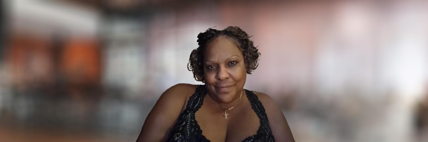 Voices of AH: Cassandra: Retirement Photo of an Apple Health (Medicaid) client with a blurred background that is indoors.