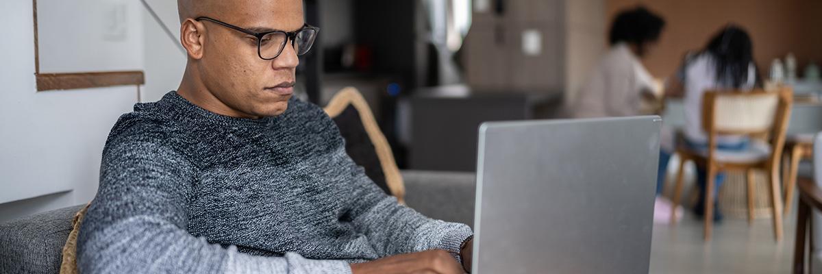 Man looking at a laptop