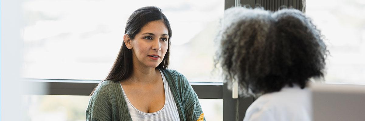 A woman talking to a doctor