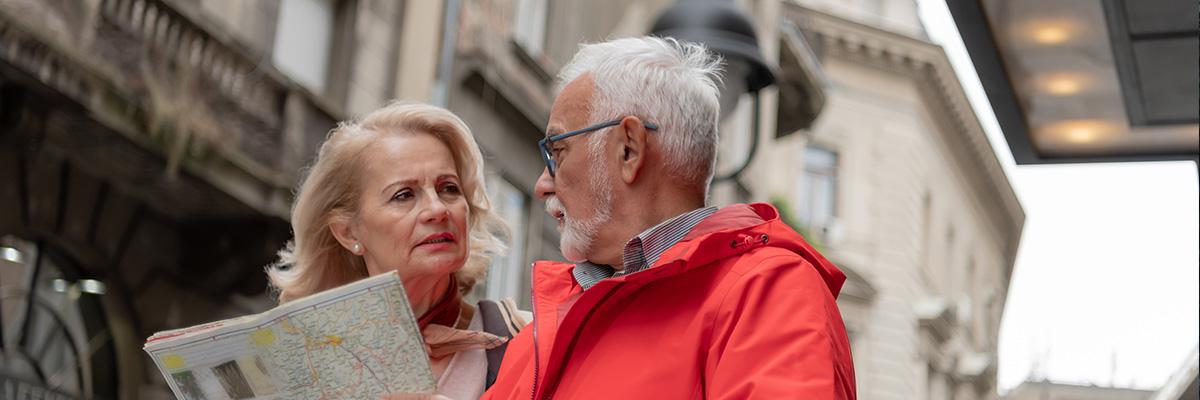 Two people walking with a map