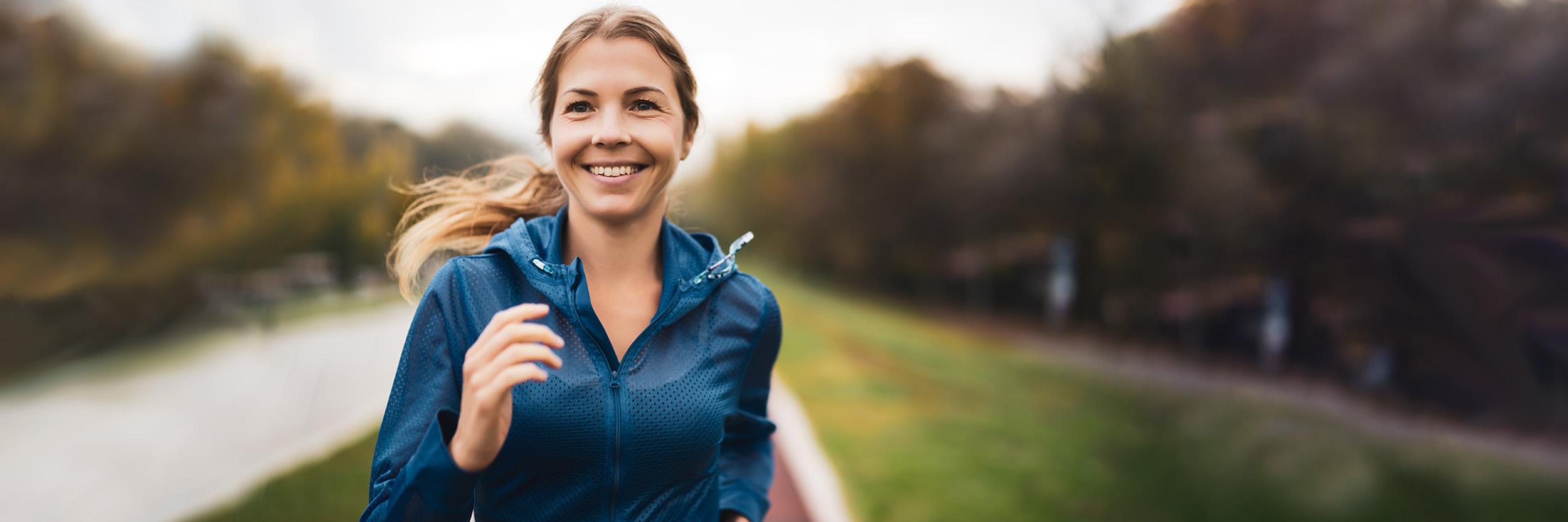 Young woman jogging in a park.